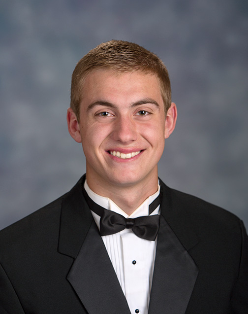 Pitman High School senior dressed for his formal tuxedo portrait